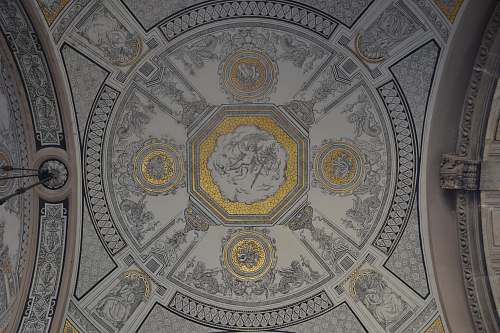 dome photo of white, gray, and yellow building ceiling grey