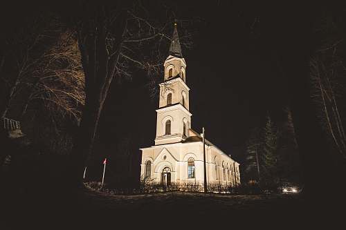 building photo of white painted cathedral tower