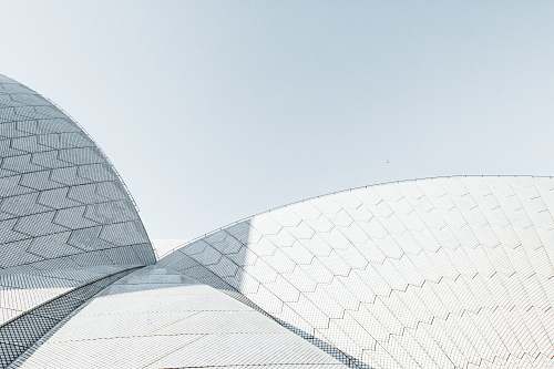 building photo of white roof grey