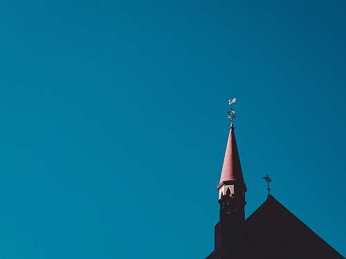 building red and gray tower spire