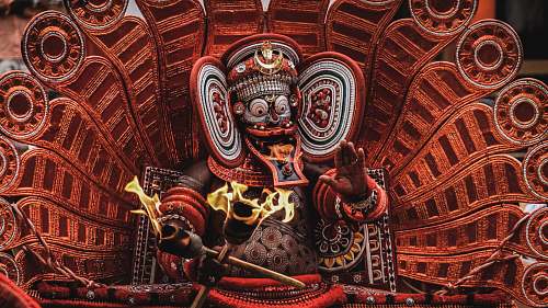 building red and white Hindu deity figurine emblem