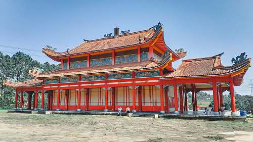 building red and white pagoda temple during daytime housing