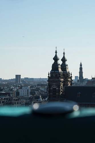 building selective-focus photograph of Gothic-style structure spire
