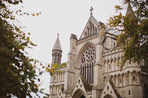 building selective focus photography of white concrete church during daytime spire