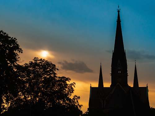 building silhouette of a building at sunset spire