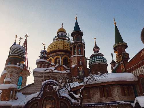 building snow covered building during day dome