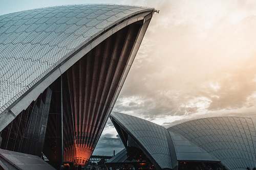building Sydney Opera under white clouds opera house