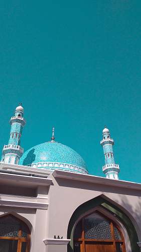 building teal and white mosque dome