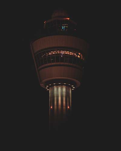 building turned-on lights on tower tower