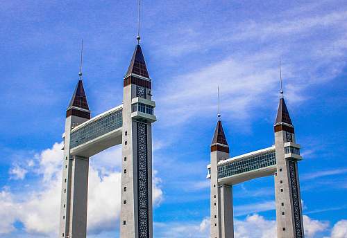 building two catles during daytime spire