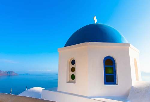 building white and blue dome building beside sea dome