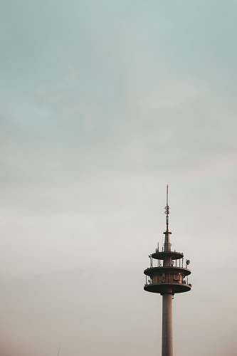 building white and brown lighthouse photograph steeple