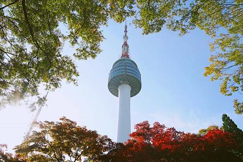 building white and gray tower under blue sky during daytime tower