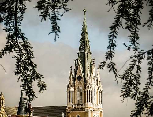 building white and green church steeple tower