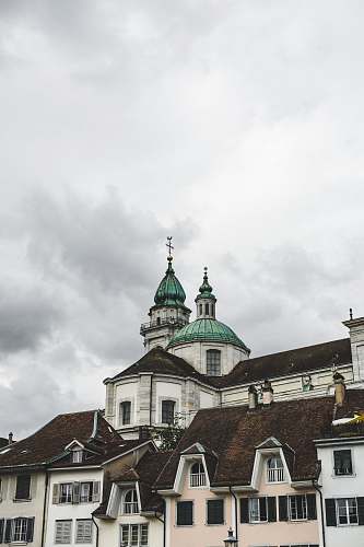 building white, brown, and green cement church dome