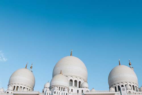 building white concrete building under blue sky at daytime dome