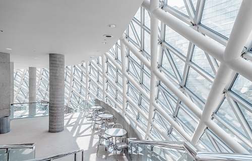 building white concrete building with chairs grey