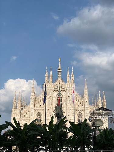 building white Gothic building with view during daytime spire