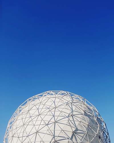 building white metal dome under blue sky dome