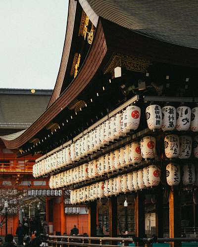 building white paper lantern lot house during daytime temple