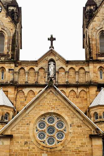 tower architectural photography of brown cathedral steeple