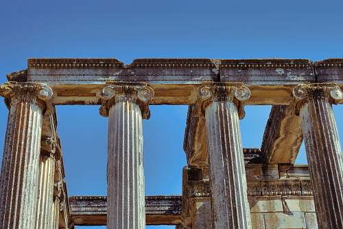 architecture architectural photography of brown monument pillars temple