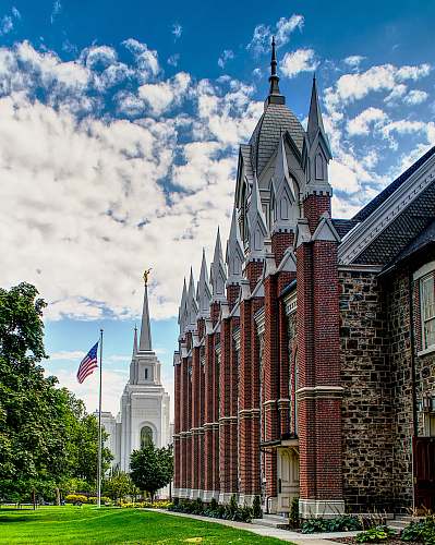 tower architectural photography of white, brown, and gray concrete house steeple