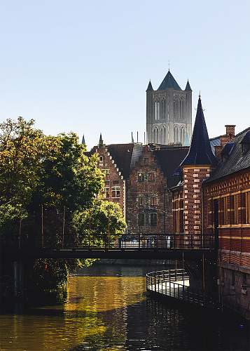 architecture body of water by buildings during daytime spire