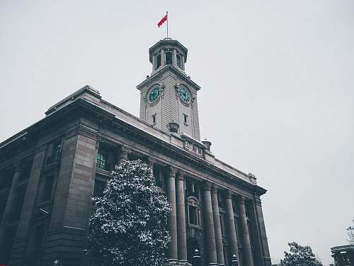 architecture brown building with clock tower