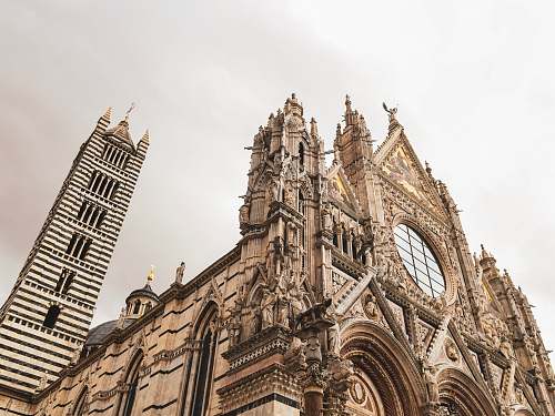 architecture gray church during daytime spire