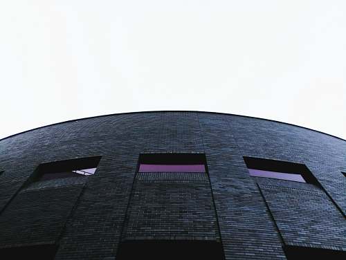 architecture grey high rise building structure brick
