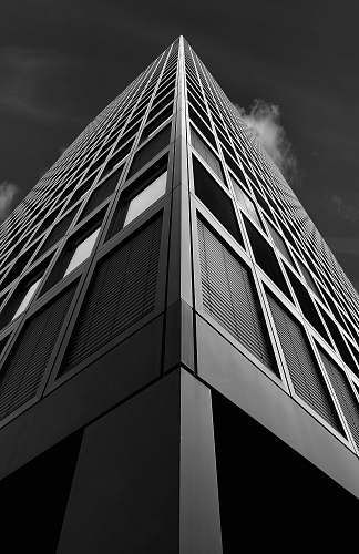 black-and-white low angle photography building skyscraper