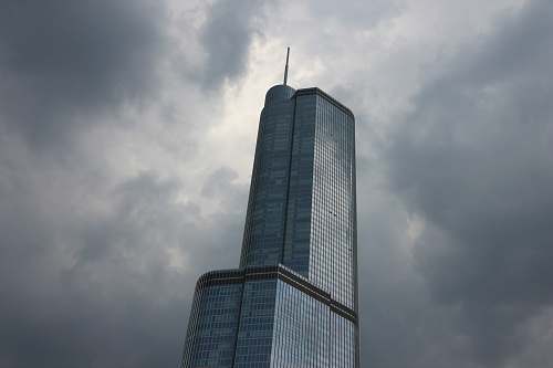 architecture low angle photography of gray high-rise building under cloudy sky skyscraper