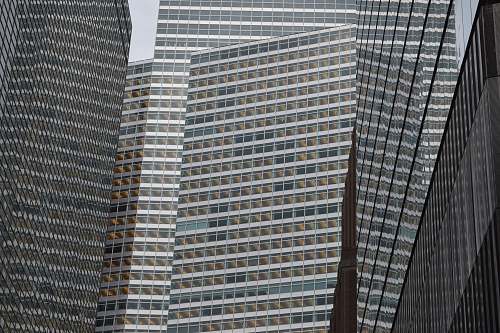 architecture low angle photography of grey high-rise buildings black-and-white