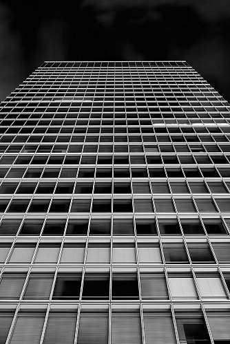 architecture low angle photography of high-rise building black-and-white