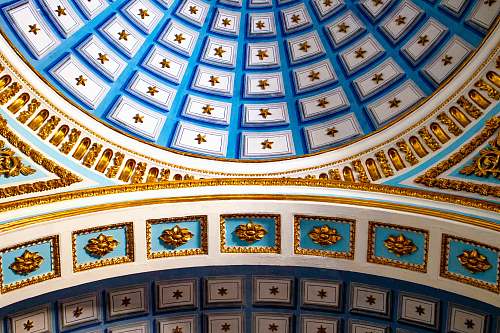 architecture low angle photography of multicolored concrete ceiling window