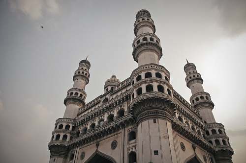 architecture low angle photography of white and black concrete building tower