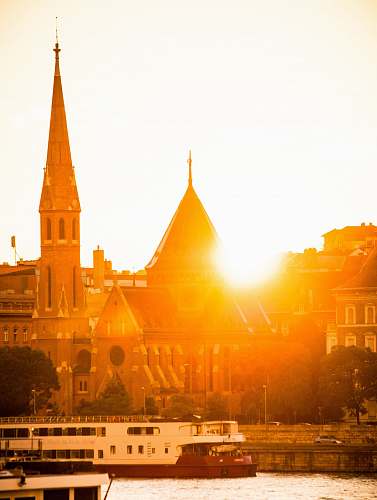 architecture sailing boat near buildings spire