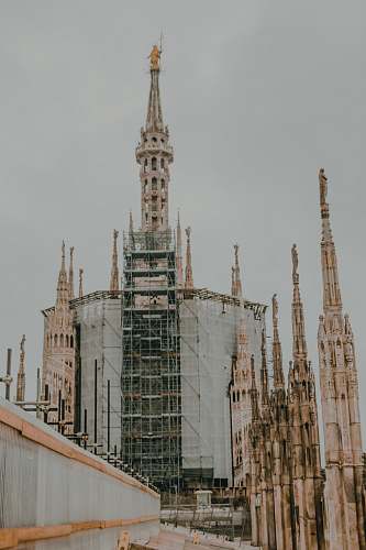 architecture selective focus photography of building during daytime spire