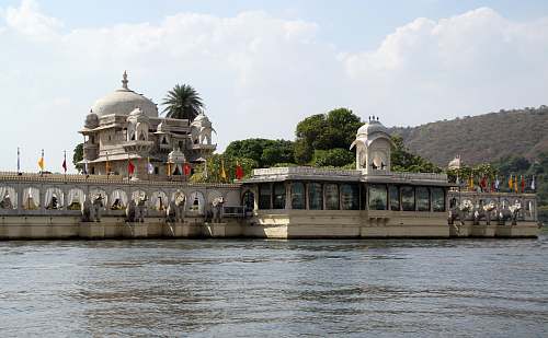 architecture white concrete building near body of water dome