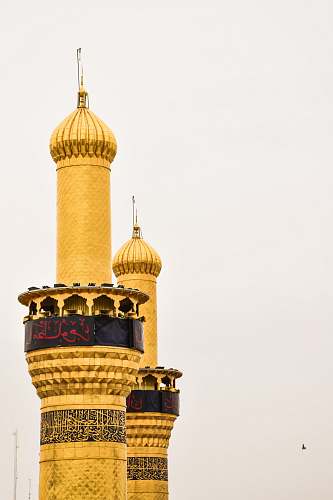 architecture brass-colored tower building