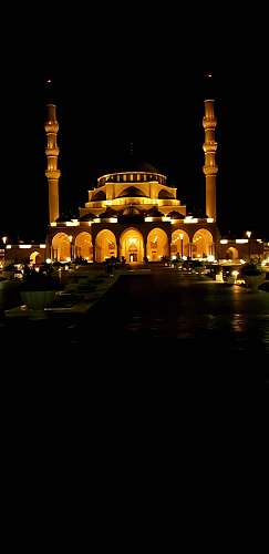 building white and yellow temple at night architecture