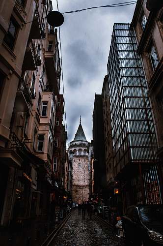 tower alley during daytime steeple