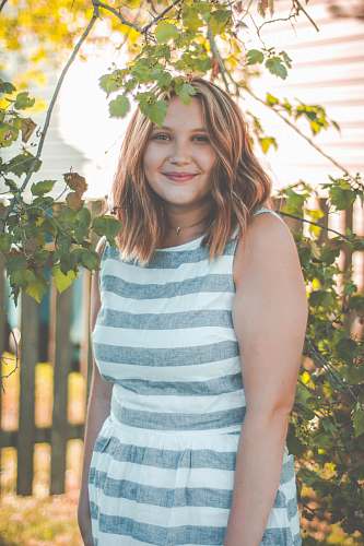  woman wearing gray and white striped dress 