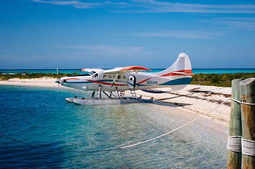 seaplane white seaplane on body of water aircraft