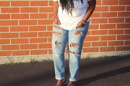 clothing person in blue denim distressed pants pants