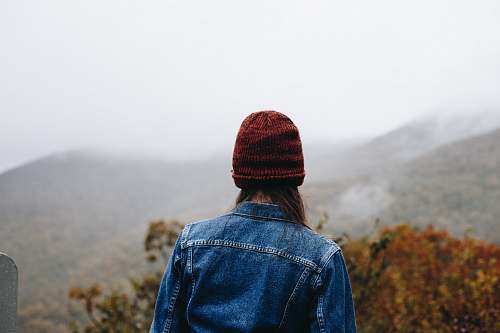 clothing person standing on top of mountain pants