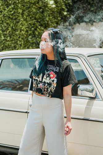 clothing time lapse photography of woman smoking cigarette human