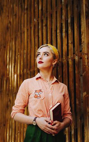 clothing woman in red and white polka dot long sleeve shirt human