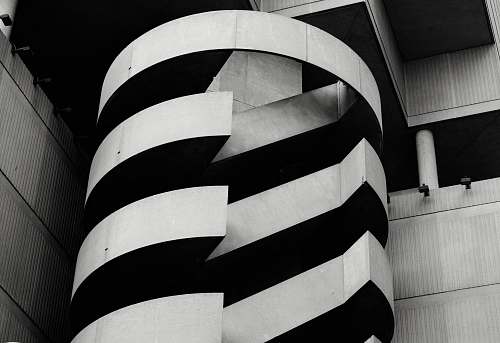 black-and-white grayscale photo of building spiral